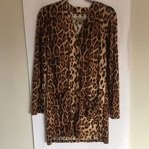 Animal print women night wear with two pockets on front.